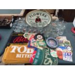 AN ASSORTMENT OF BRANDED PUB ITEMS TO INCLUDE GLASSES, TRAYS AND BAR CLOTHS ETC