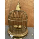 A VINTAGE BRASS BIRD CAGE WITH TWO PERCHES AND FEED BOWLS