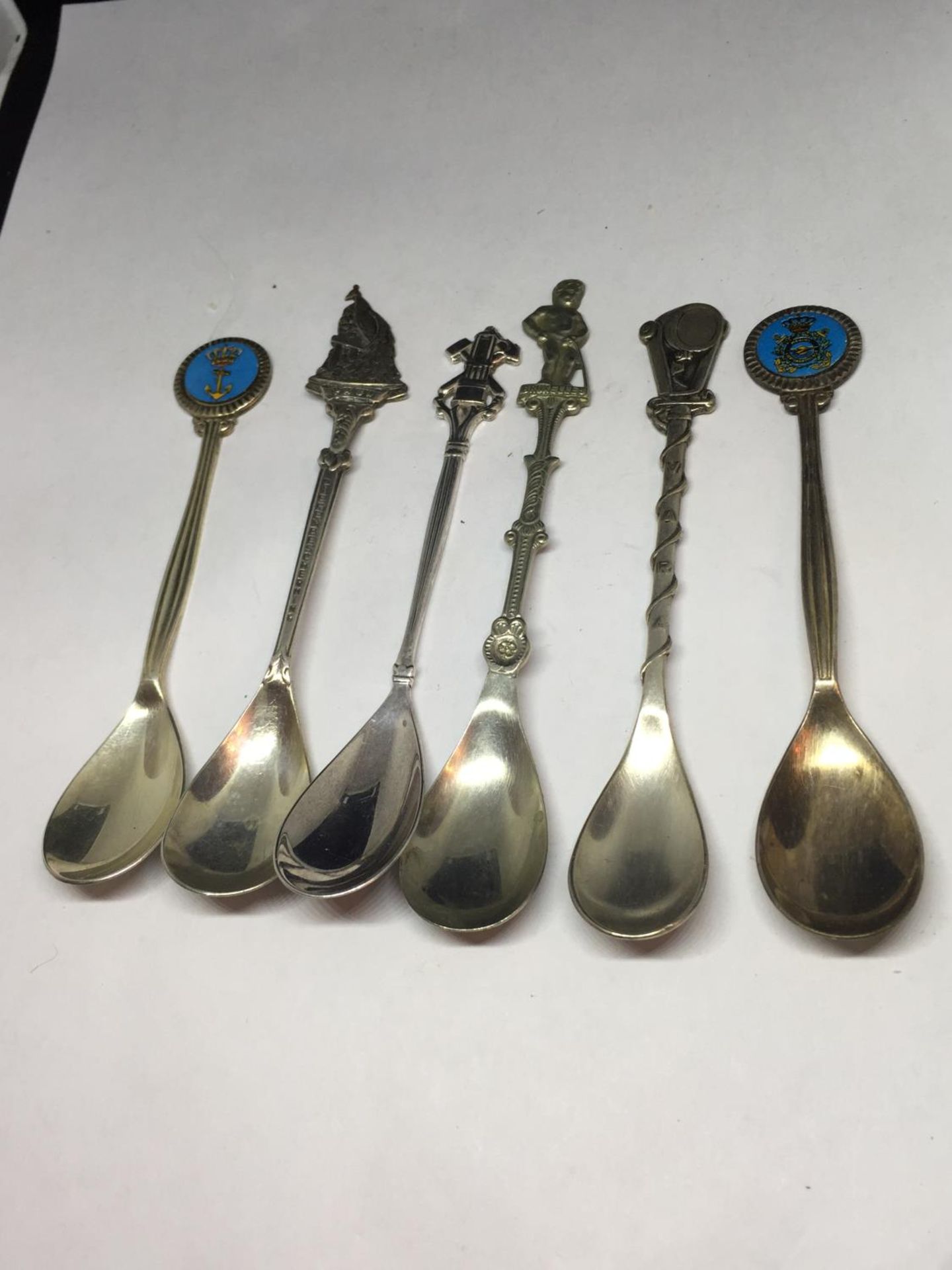 SIX ORNATE COLLECTORS SPOONS