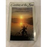 A FIRST EDITION HARDBACK CARP FISHING BOOK 'CASTING THE SUN' BY CHRISTOPHER YATES WITH DUST COVER.