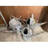 THREE VINTAGE GALVANISED WATERING CANS