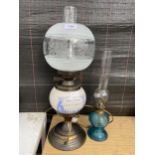 TWO VINTAGE OIL LAMPS TO INCLUDE A DEMIJOHNS CHOICE LIQUORS ADVERTISING LAMP CONVERTED TO