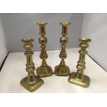 FOUR BRASS CANDLESTICKS, TWO HEIGHT 27CM, TWO HEIGHT 22CM