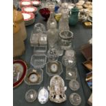 A COLLECTION OF GLASSWARE TO INCLUDE, DECANTERS, AN ICE BUCKET, BOWLS, VASES, TWO SMALL CLOCKS,