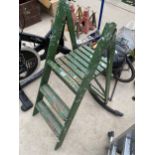 A VINTAGE TWO RUNG WOODEN STEP LADDER