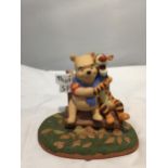 A DISNEY POOH AND FRIENDS CERAMIC FIGURE 'FALL COLORS CHARM US AS LEAVES BLOW' LIMITED EDITION