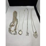 FOUR MARKED SILVER NECKLACES WITH PENDANTS TO INCLUDE A THREE STRAND SILVER GILT, TWO HEART ETC