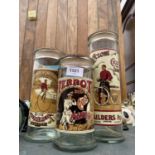 THREE GRADUATED VINTAGE GLASS JARS WITH CORK STOPPERS TO INCLUDE TERROT, COLUMBIA BICYCLE AND