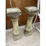 A PAIR OF RECONSTITUTED STONE TURNED COLUMN PLANT STANDS