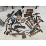 AN ASSORTMENT OF VINTAGE HAND TOOLS TO INCLUDE SAWS, SPANNERS, HAMMERS AND AXES ETC