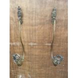 A PAIR OF VINTAGE BRASS CURTAIN TIE BACKS