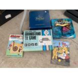 AN ASSORTMENT OF GAMES AND BOOKS TO INCLUDE ADMAN MODEL 3000 GRANDSTAND TV GAME, AND TRIVIAL PURSUIT