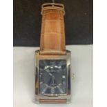 A BEN SHERMAN WRIST WATCH WITH A TAN LEATHER STRAP SEEN WORKING BUT NO WARRANTY