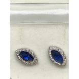 A PAIR OF SILVER EARRINGS WITH DIAMONDS AND SAPPHIRES IN A PRESENTATION BOX