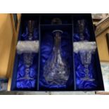 A BOXED HEAVY CUT GLASS CRYSTAL DECANTER AND FOUR GLASSES, WITH INSCRIPTION 'LONG SERVICE AWARDS'