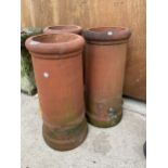 THREE VINTAGE TERRACOTTA CHIMNEY POTS