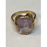 A MARKED 9 CARAT GOLD RING WITH A PINK COLOURED STONE SIZE L