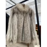 A LADIES SIZE 16 SAGA FOX FUR COAT