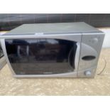A SILVER SAMSUNG MICROWAVE OVEN