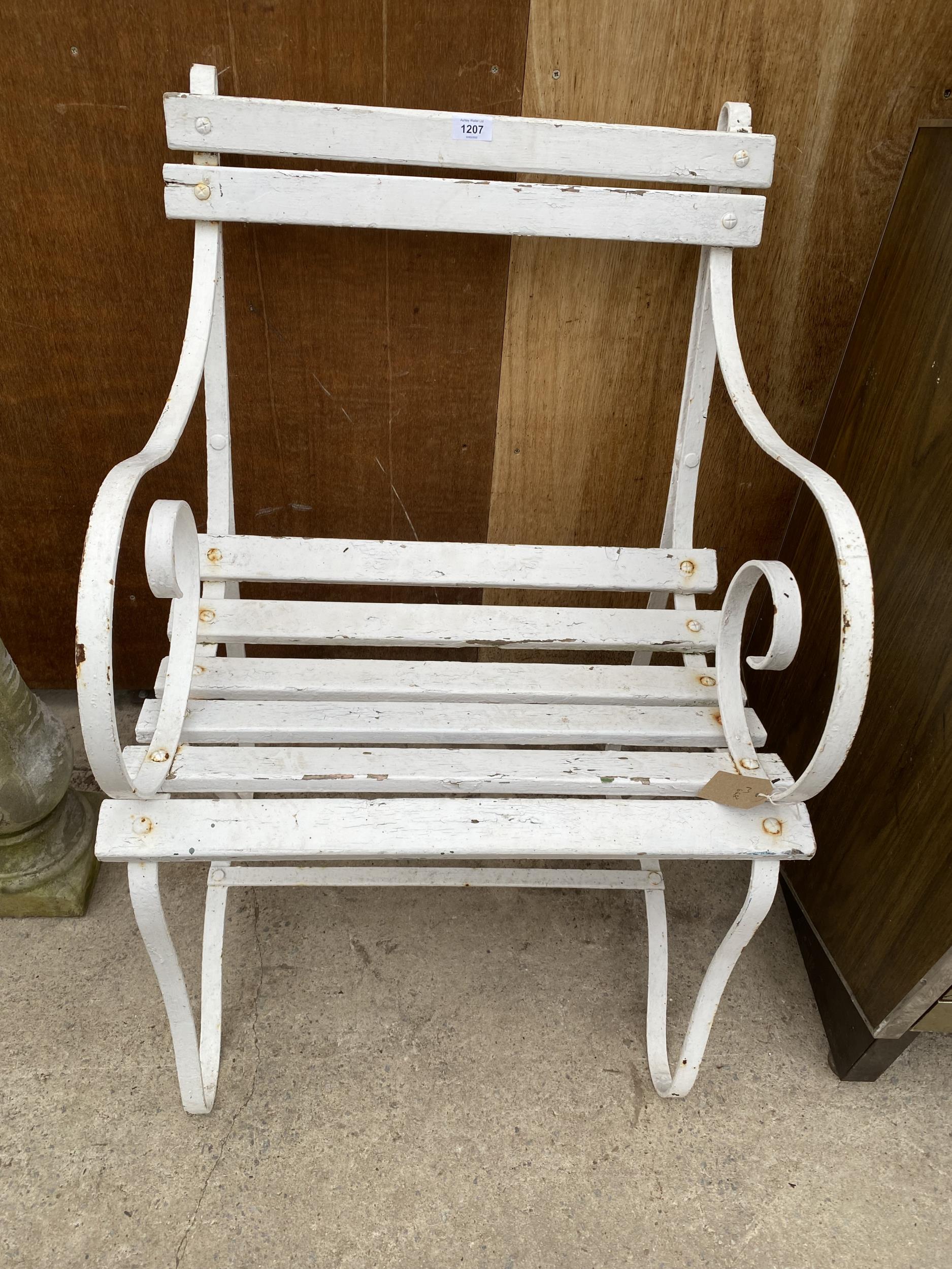 A VINTAGE ARM CHAIR WITH WROUGHT IRON ENDS AND SLATTED SEAT AND BACK