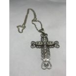 A MARKED SILVER NECKLACE WITH A LARGE ORNATE CLEAR STONE CROSS