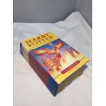A FIRST EDITION HARD BACK BOOK WITH DUST JACKET OF HARRY POTTER AND THE ORDER OF THE PHOENIX