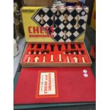 A BOXED CHESS SET AND A DRAUGHTS BOARD