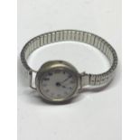 A WWI TRENCH WATCH WITH ELASTICATED STRAP (A/F) IN A PRESENTATION BOX