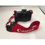 A CANON EOS 650 DIGITAL CAMERA WITH CANON STRAP