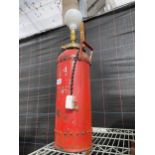 A VINTAGE FIRE EXTINGUISHER CONVERTED INTO AN ELECTRIC LAMP