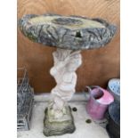 A RECONSTITUTED STONE BIRD BATH WITH CHERUB PEDESTAL BASE