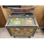 A VINTAGE JUKE BOX FOR RESTORATION TO INCLUDE AN ASSORTMENT OF RECORDS