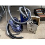 TWO VACUUM CLEANERS TO INCLUDE A RUSSELL HOBBS CYCLONIC 2200, A MIELE AND A LARGE ASSORTMENT OF