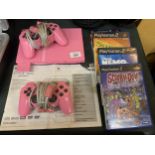 A PINK PLAYSTATION 2 SLIM WITH 2 CONTROLLERS AND FOUR GAMES - SCOOBY DOO, FINDING NERO SHREK 2 AND A