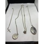 FOUR MARKED SILVER NECKLACES WITH PENDANTS TO INCLUDE A CROSS, LOCKET ETC