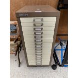 A MINITURE BISLEY SIXTEEN DRAWER FILING CABINET