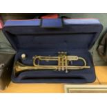 A BRASS TRUMPET IN A CARRYING CASE