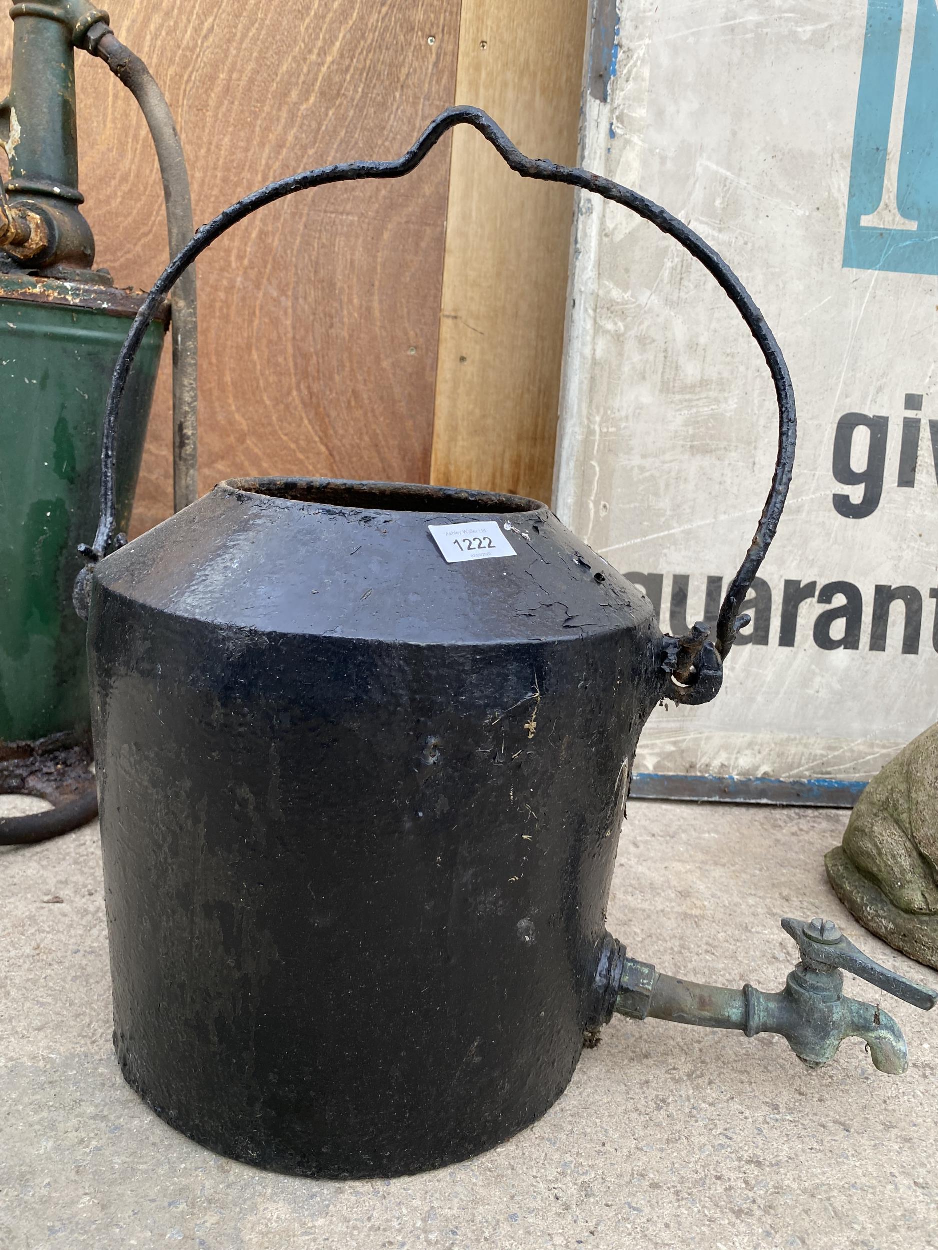A VINTAGE CAST IRON HANGING WATER KETTLE WITH BRASS TAP