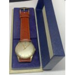 A CERTINA WRIST WATCH WITH A LEATHER STRAP IN ITS PRESENTATION BOX