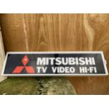 AN ILLUMINATED 'MITSUBISHI' SIGN