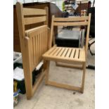 A PAIR OF WOODEN FOLDING CHAIRS