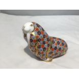 A ROYAL CROWN DERBY WALRUS WITH GOLD COLOURED STOPPER