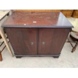 A MAHOGANY AND INLAID TV CABINET