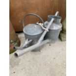 TWO VINTAGE GALVANISED WATERING CANS TO INCLUDE ONE BEARING THE LABEL HAWS