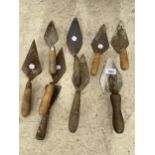 AN ASSORTMENT OF BUILDERS TROWELS