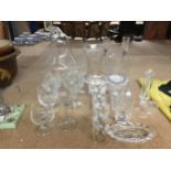 A QUANTITY OF GLASSWARE TO INCLUDE, CANDLE HOLDERS, VASES, GLASSES, JUG, ETC