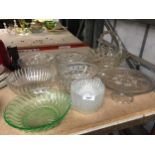 A QUANTITY OF GLASSWARE TO INCLUDE, AN ORNAMENTAL BASKET, CAKE STAND, FIVE HEAVY BOWLS AND SIX