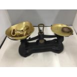 A VINTAGE LIBRA SET OF SCALES WITH BRASS PANS AND WEIGHTS