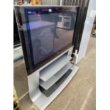 A PANASONIC 46" TELEVISION ON BUILT ON TV STAND