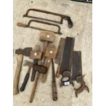 AN ASSORTMENT OF VINTAGE HAND TOOLS TO INCLUDE AXES, SAWS AND MALLETS ETC